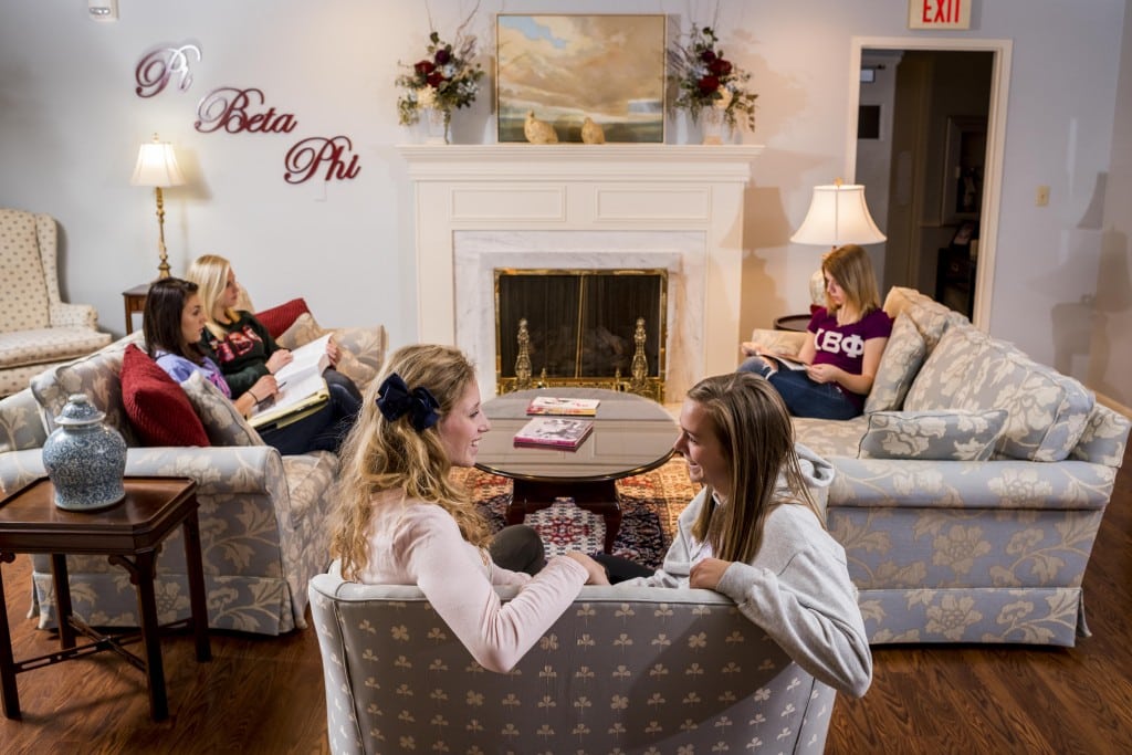 Pi Beta Phi members relaxing in the sorority house living room.